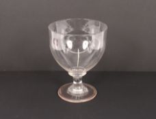 An early 19th Century glass rummer of large size, raised on a baluster stem and spread foot, 17cm
