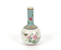 A Chinese bottle vase, having floral and bird decoration in brightly coloured enamels, red