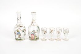 Emile Gallé Nancy, a pair of liqueur decanters and four glasses, finely enamelled with scenes of a