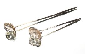 A George II silver toddy ladle, having foliate decorated shaped bowl and whalebone twist handle,