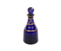 An early 19th Century Bristol blue glass 'Soy' bottle,  and stopper with gilt decoration, 21.5cm