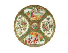 A pair of Canton plates, decorated in the traditional manner; an Oriental hardwood panel with