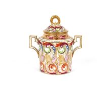 A rare Derby porcelain sucrier and cover, painted crimson 1784-1810, 13cm high