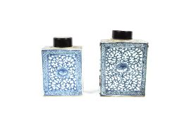 Two Chinese blue and white tea cannisters, having hard wood lids, the largest 23cm high x 11cm long