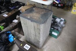 Large wooden block stand for anvil.