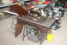 A Jones treadle operated sewing machine and a vintage trouser press