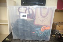 Crate of various equestrian equipment.