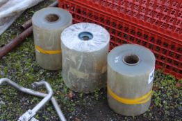 Three rolls unused clear plastic.