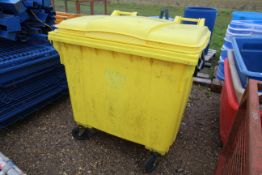 Yellow commercial wheelie bin. V