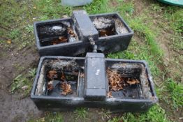 2x plastic water troughs.
