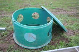 Plastic in field horse hay feeder.