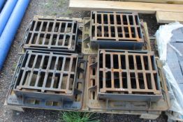 Quantity of man hole covers with grates. V