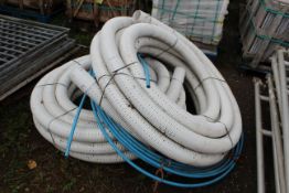 Quantity of various plastic piping.