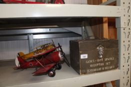Two tin plate model planes and a wooden storage bo
