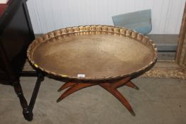 A brass topped Benares style table