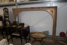 An ornate gilt picture frame approx. 202cms wide x