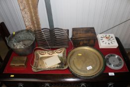A cast iron book rest; a swing handled pot; silver