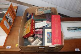A box containing various playing cards, cribbage s