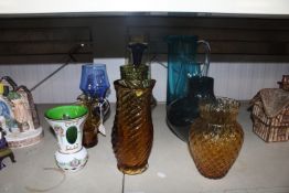 A quantity of coloured glass ware to include vases