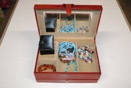 A jewellery box and contents to include amber colo