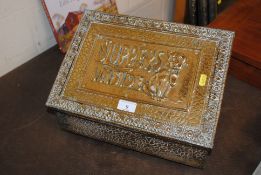 A brass embossed slipper box decorated with Bonzo