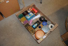 A box containing various perfumes, powder bowls et
