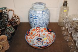 An Oriental blue and white ginger jar and cover together with an Oriental Imari pattern bowl