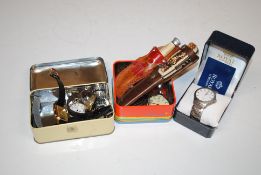 Two tins containing various wrist watches to inclu