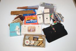 A box containing purses, scent bottles, trinket bo