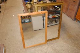 Two modern oblong wall mirrors