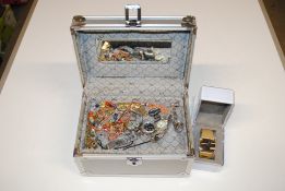 A case containing various costume jewellery and w