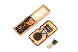 A cased Belgium Labour medal with a cased Life Saving medal and for Efficient Service miniature
