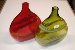 A red Art Glass vase with steaked pattern and simi