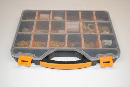 A plastic storage box containing a quantity of gol