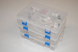 Three plastic storage boxes containing various 925