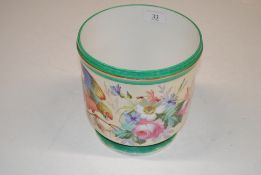 A jardinière decorated with a parrot and flowers