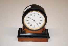 A French mantel clock with oak and ebonised case