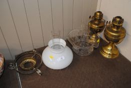 Two brass oil lamps and shades
