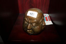 A reproduction four faced Buddha head (32)