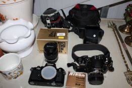 A Nikon FM2 camera together with a Nikon FE2 camer