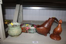 A carved wooden drinking vessel, a carved wooden o