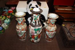 A pair of famille rose decorated Oriental baluste