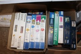 Two boxes of jigsaw puzzles