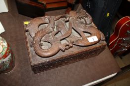 A carved dragon decorated box, the lid inscribed '