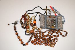 A box containing various bead necklaces, wrist wat