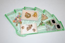 An Art Deco green glass dressing table tray and co