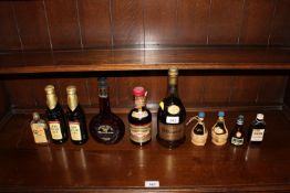 A bottle of Bisquit Cognac together with a quantit