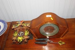A West German cuckoo clock together with a Smiths
