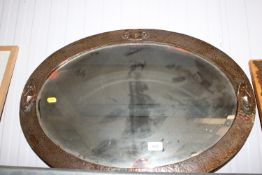 An Arts and Crafts style copper framed and bevel e
