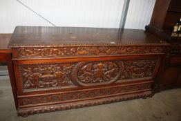A profusely carved camphor wood chest approx. 160cm long x 51.5 cm deep